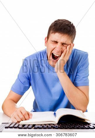 Tired Student Yawning On The School Desk Isolated On The White Background