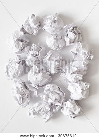 Waste Reduction. Flat Lay Of Crumpled Paper Ball Pile On White Surface. Abstract Background.