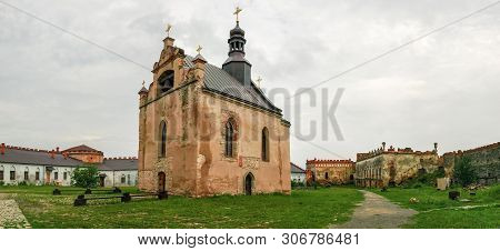 Ancient Brick Medzhybizh Fortress Of The 14-16th Centuries. Courtyard With Stone Castle Church Of Th