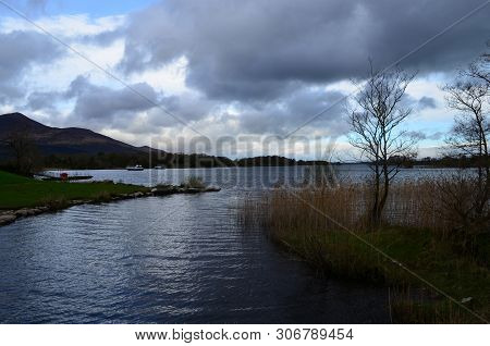 Gray Storm Clouds Gathering Over A Lake In Killarney Naitonal Park Ireland.