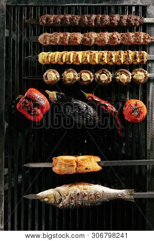 Big Set of Grilled Lule Kebab, Whole Barbecue Vegetables and Fish on Grill Top View. Skewered Bbq Minced Meat Mix of Poultry, Veal and Lamb with Mushrooms and Spices Collection