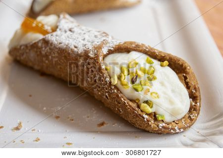 Traditional Sicilian Cannolo With Ricotta Cream And Pistachios