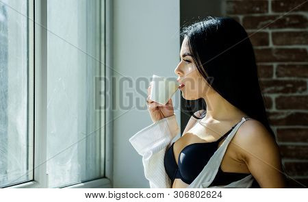 A Good Drink For Breakfast. Adorable Woman Drinking Coffee For Breakfast. Sensual Girl Enjoying Her 