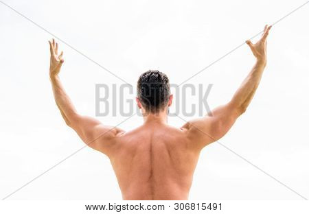 Man Celebrating Success. Bodybuilder Strong Muscular Body Feeling Powerful And Superior Rear View. A