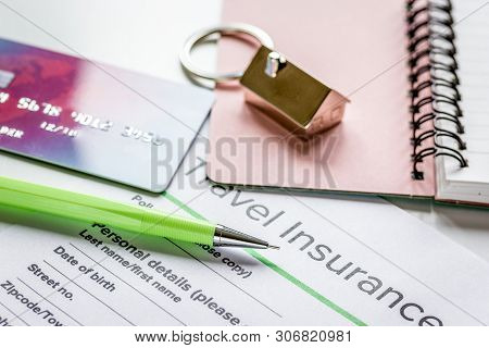 Traveling Concept With Insurance Application And Cards On White Table
