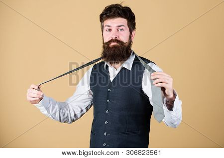 Start With Your Collar Up And The Tie Around Your Neck. Art Of Manliness. Man Bearded Hipster Try To
