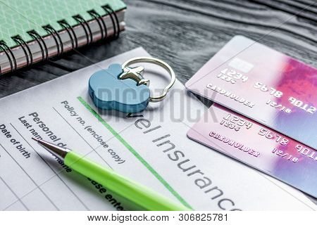 Booking Travel Concept With Insurance On Wooden Table Background