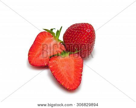 Ripe Juicy Red Strawberries - 2 Slices And One Whole Cut On A White Background Isolated
