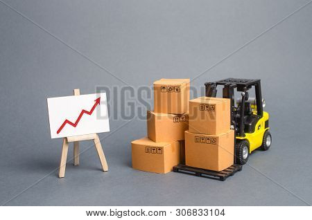 Yellow Forklift Truck With Cardboard Boxes And A Red Arrow Up. Increase Sales, Production Of Goods. 