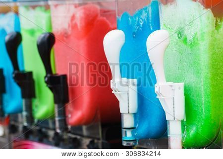 Close Up Of Slush Machine. Slushy Ice Made Colorful Drink Refreshing During Summer