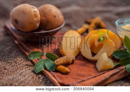 Potato Face Mask Consisting Of Grated Potato And Some Turmeric Powder Or Haldi In A Glass Bowl On Ju