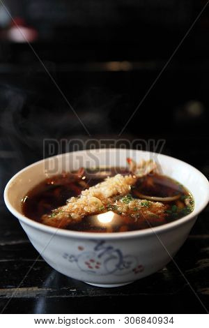 Udon Noodles With Shrimp Tempura On A Bowl