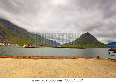Fjord Coast Landscape. Typical Norwegian Fishing Village With Traditional Red Rorbu Huts, Ramberg, L