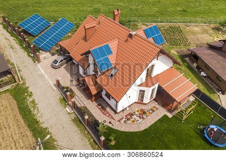 Aerial Top View Of New Modern Residential House Cottage With Blue Shiny Solar Photo Voltaic Panels S