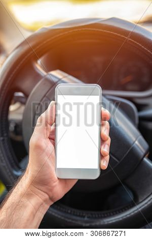 Using Smartphone In Car, Mock Up Blank Screen Of Mobile Phone Device In Hand Of Adult Caucasian Male