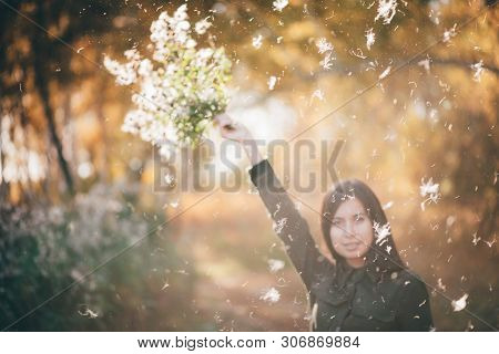 Dreamy Beautiful Girl In White Fluff On Bokeh Background With Yellow Leaves In Golden Sunlight. Insp