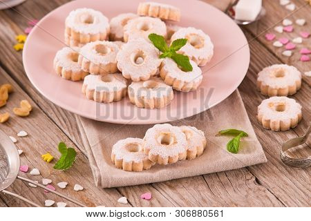 Canestrelli Biscuits With Mint On Wooden Table.