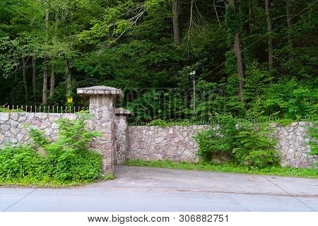 Ntrance Through The Gates To The Territory Under The Close Supervision Of The Security Camera On The
