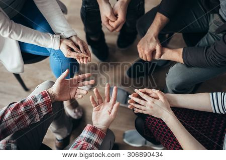 Shot From Above Of People's Hands During Psychoterapy Group Session