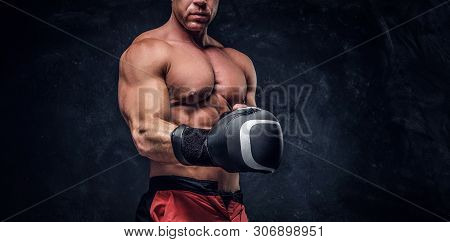 Serious Muskular Man Get Prepared For Boxing, His Is Wearing His Boxer Gloves.