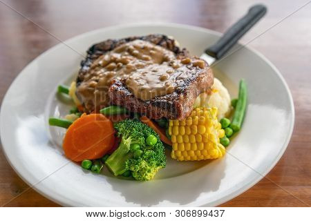A Typical Aussie Pub Meal Of Steak With Peppercorn Sauce And Vegetables Served In An Australian Hote