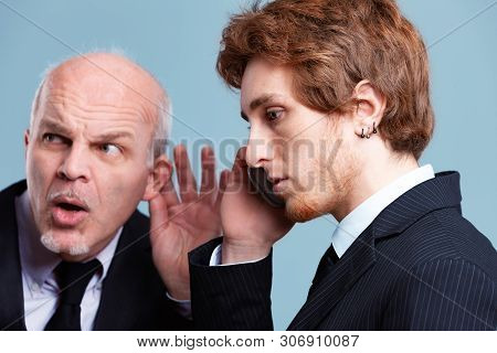 Inquisitive Boss Eavesdropping On A Young Employee
