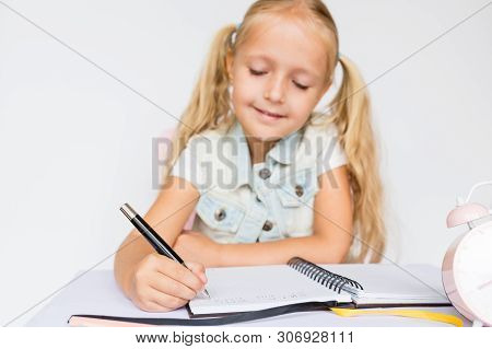Back To School And Happy Time. Children Holding Pen And Writting In Notebook On White Background. Ki