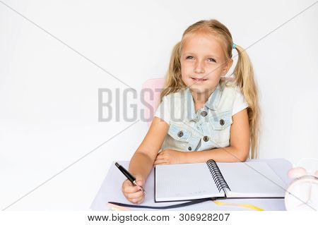 Back To School And Happy Time. Children Holding Pen And Writting In Notebook On White Background. Ki