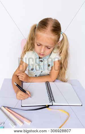 Back To School And Happy Time. Children Holding Pen And Writting In Notebook On White Background. Ki
