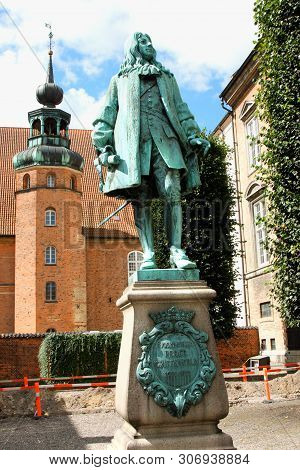 Copenhagen, Denmark: May 1, 2019 - The Statue Of Chancellor Peder Griffenfeld And A Tower In Copenha