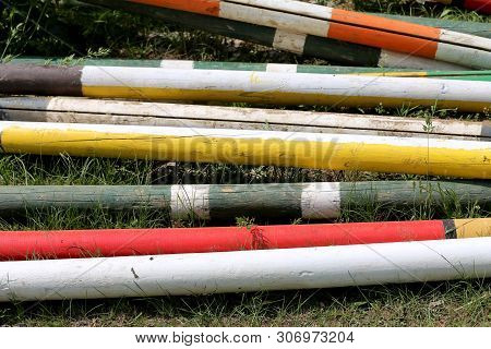 Image Of Show Jumping Poles On The Training Field. Wooden Barriers For Jumping Horses As A Backgroun
