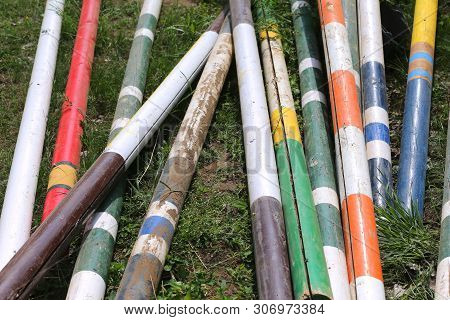 Image Of Show Jumping Poles On The Training Field. Wooden Barriers For Jumping Horses As A Backgroun
