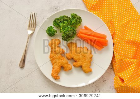 Kids Food. Dinosaur Shaped Chicken, Fish Or Turkey Nuggets, Ready To Eat.