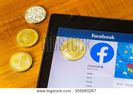 Prague, Czech Republic - June 18 2019: Golden Ripple, Bitcoin And Ethereum Coins Lying On Homepage O