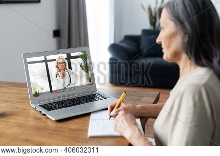 Video Conference With A Doctor, Video Consultation Online. A Female Doctor, Therapy Recommends Treat