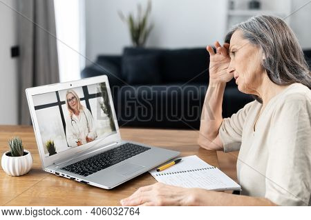 Video Conference With A Doctor, Video Consultation Online. A Female Doctor, Therapy Recommends Treat
