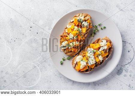 Baked Pumpkin Sandwich With Dorblu Cheese With Blue Mold, Honey And Thyme On A Concrete Old Light Ba