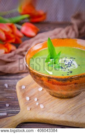 Homemade Spting Green Cream Soup With Wild Leek On A Wooden Background. Rustic Style