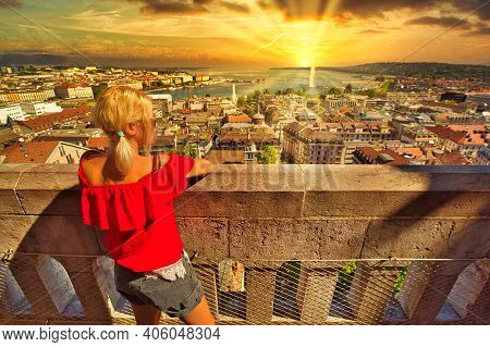 Dramatic Stormy Sky With Sunset Colors Over Bay Of Geneva Lake. Tourist Girl Looking Geneva Skyline,