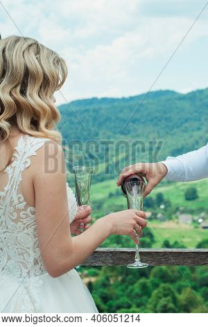 Glasses With Red Champagne Drink. Groom Pouring Wine. Happy Newlyweds Drinking. Loving Couple Create