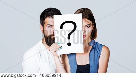 Couple Holding Paper Question Mark. Anonymous, Man And Woman Question, Incognita. Problems And Solut