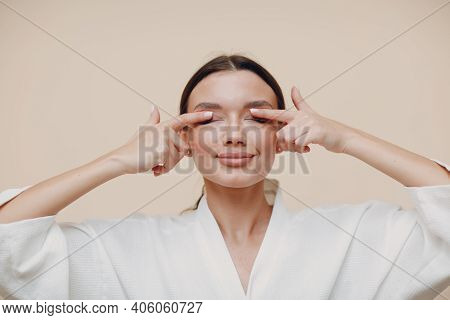 Young Woman Doing Face Building Facial Gymnastics Self Massage And Rejuvenating Exercises