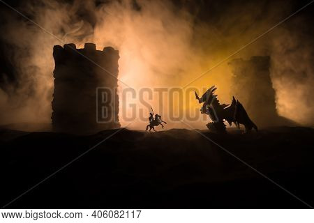 Battle Between Dragon And Heroic Soldiers. Creative Table Decoration. Selective Focus
