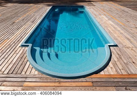 New Modern Fiberglass Plastic Swimming Pool Entrance Step With Clean Fresh Refreshing Blue Water On 