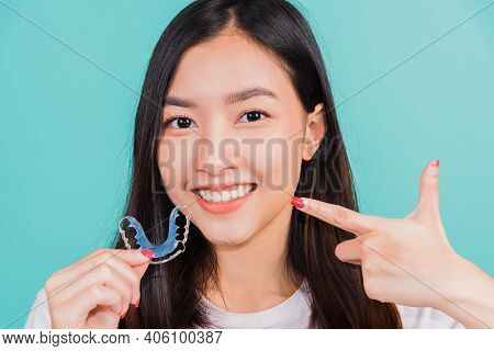 Female Hold Teeth Retaining Tools After Removable Braces, Portrait Young Asian Beautiful Woman Smili