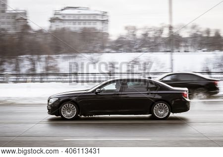 Moscow, Russia - January 15, 2021: Bmw F02 750li Moving Fast On Winter Street. Side View Of Black Fu