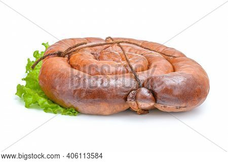 Smoked Sausage Twisted In A Spiral And Bound With A Beechnut, Isolated On A White Background.