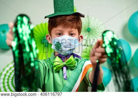 Young Kid With Medical Face Mask Dancing By Holding Pom Pom On Decorated Background At Home During S