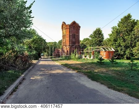 Ruined Tower Of The Former City Baths In Putyvl Outdoors Among Green Thickets On A Sunny Summer Day 