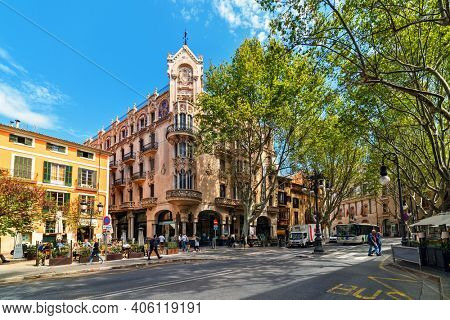 PALMA, SPAIN - APRIL 11, 2019: People walking on the street in the city center of Palma - aka Palma de Mallorca, capital and largest city of he Balearic Islands in Spain, popular tourist destination.